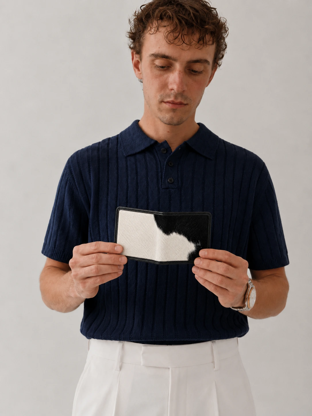 SAVI wallet held as part of quiet luxury styling